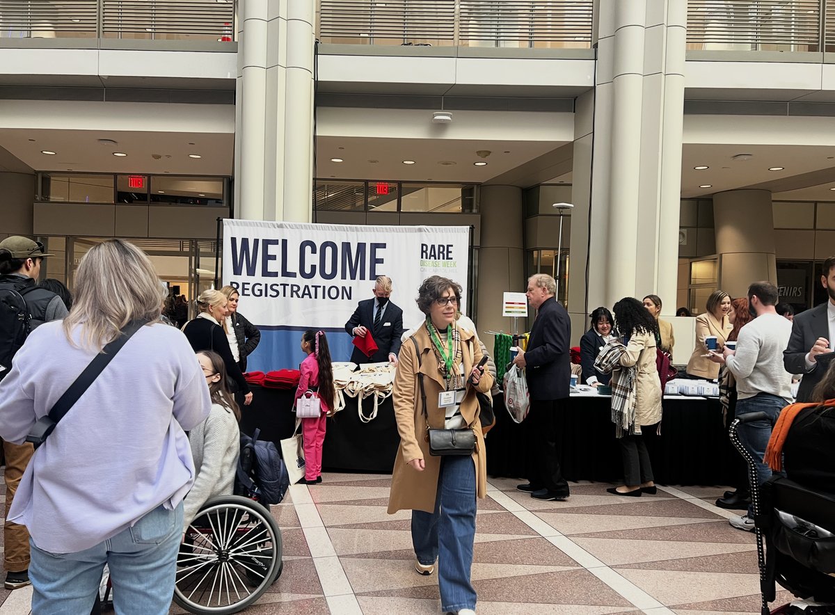 Attendees at a rare disease event registration desk
